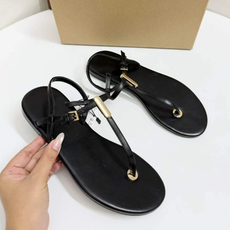 Women's Chic Black Faux Leather T Strap Thong Flat Sandals with Gold Metal Ring Detail Ankle Buckle Summer Beach Shoes 2026