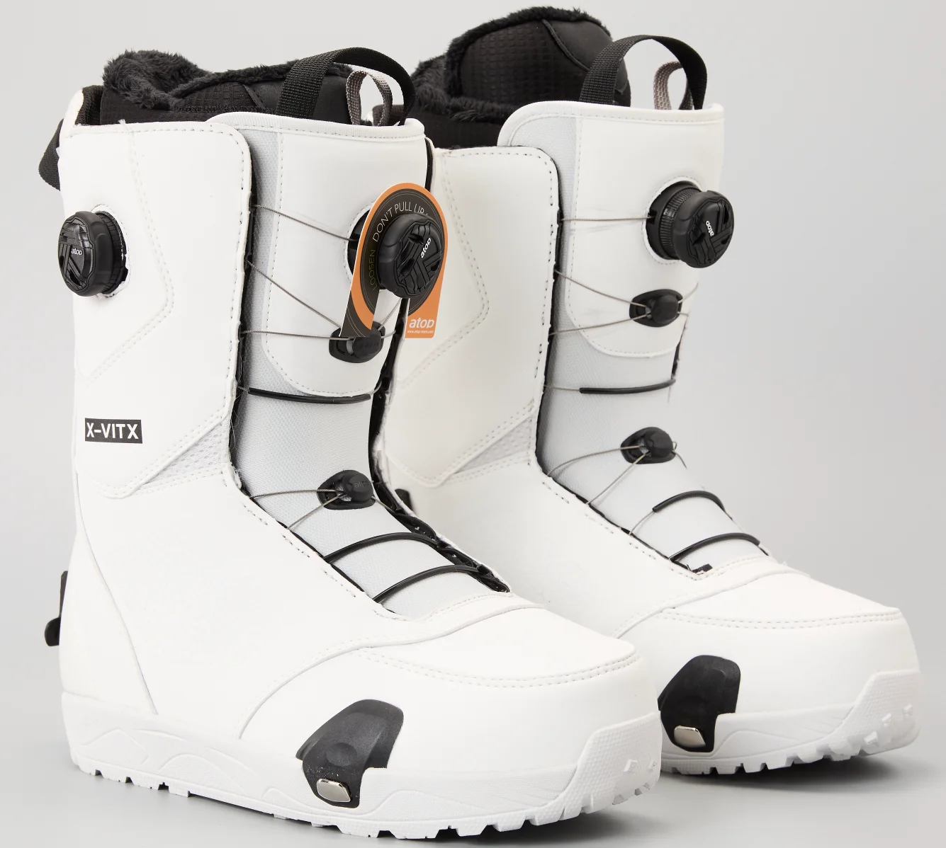 

Easy to use foot operated ski boots in white and black