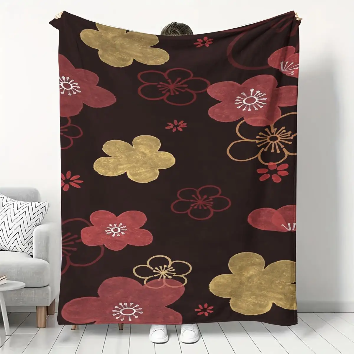 A red and gold floral patterned blanket made of polyester fabric, suitable for bedroom and living room décor.