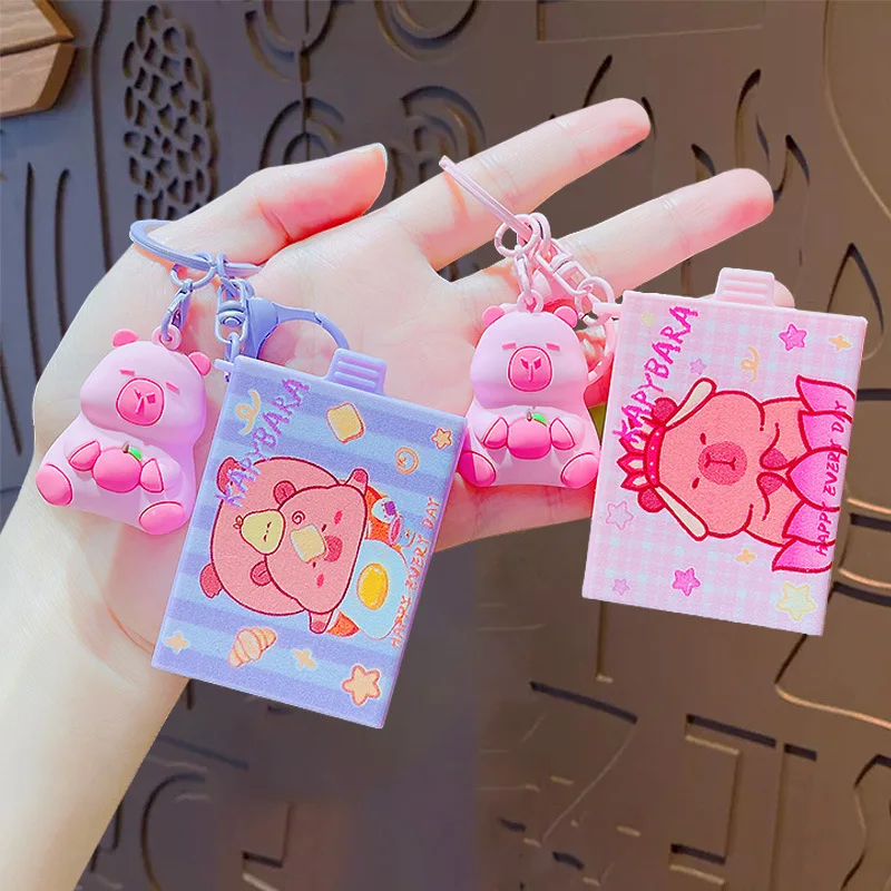 Creative Hug Orange Kapibala Magic Box Kids Toy Keychain Cute Eat Apple Swimming Ring Play Water Capybara Doll Animal Key Chains