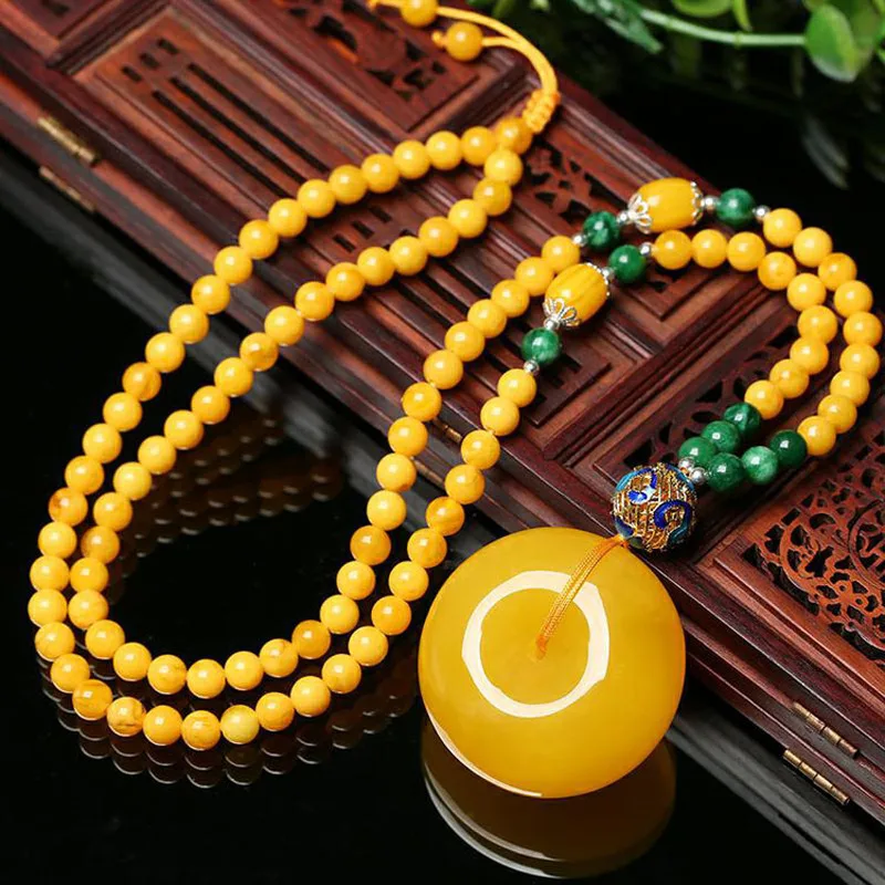 Amber peace pendant, chicken oil yellow raw stone carving, unisex sweater chain, honey wax necklace