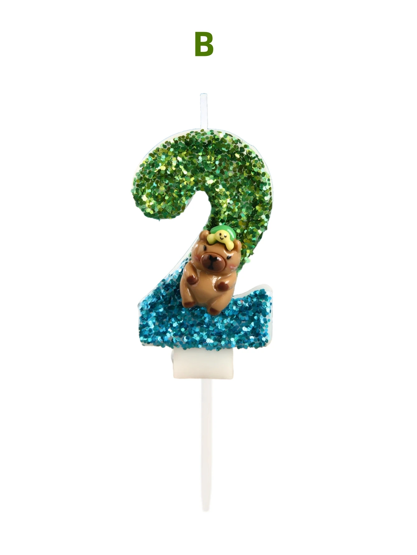 Green and blue cardboard capibara-shaped birthday candles with turtle decorations, as well as holiday and commemorative candles