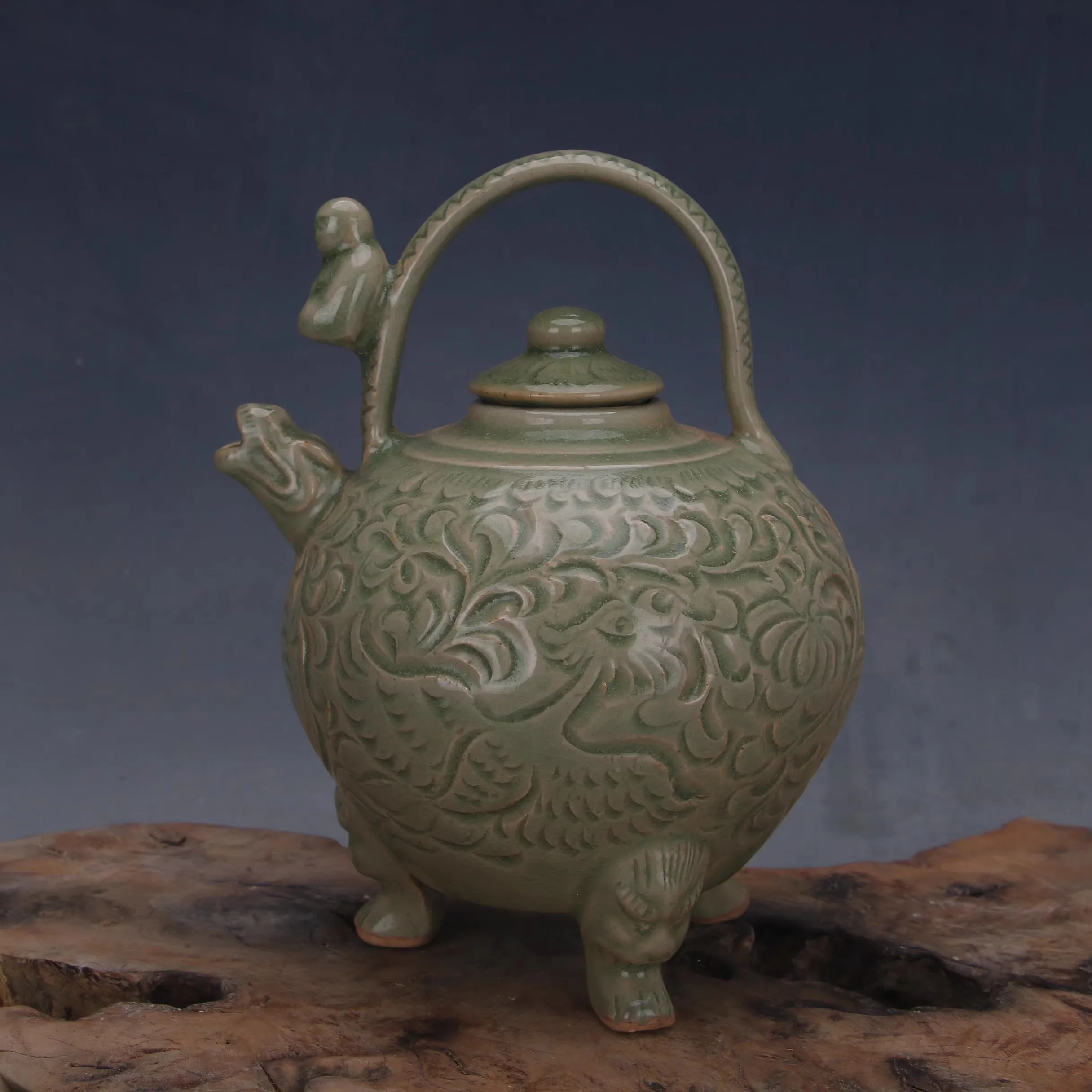 Yaozhou District kiln teapots with green glaze engraved with lotus twigs and Phoenix motifs