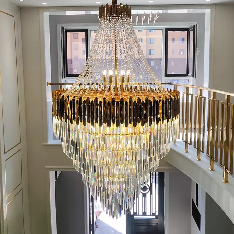 Crystal chandelier in the living room of duplex villa, spiral staircase , modern luxury   