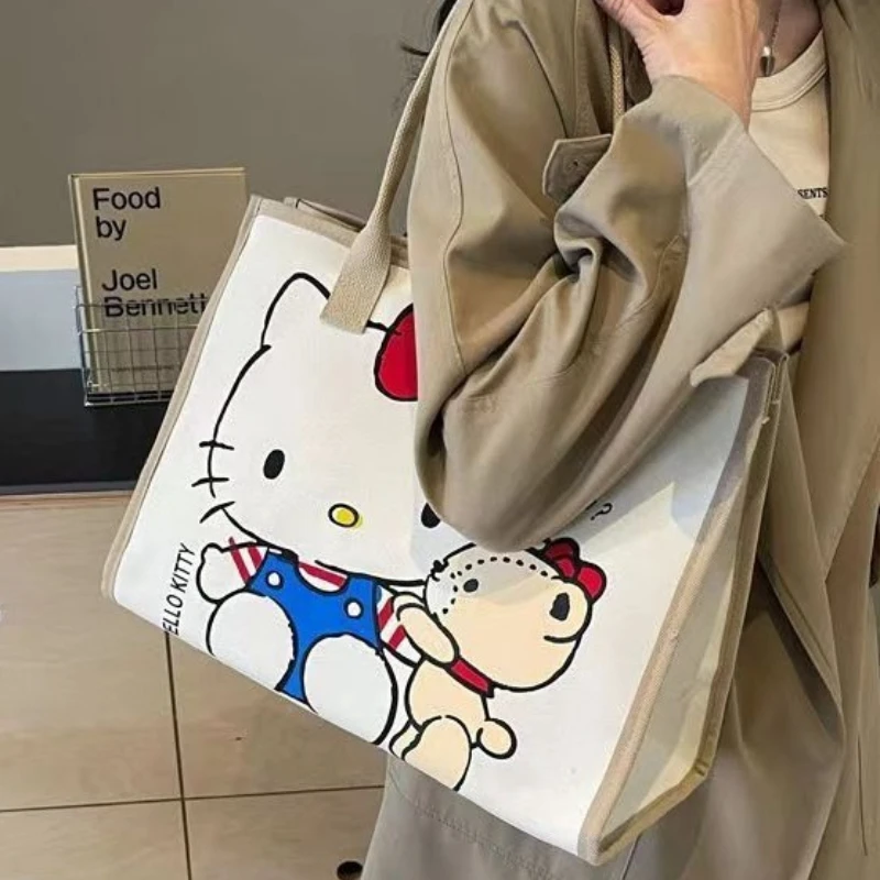 

Large Capacity Cartoon Canvas Bag 2026 New Hello Kitty Fashionable Tote Bag for Outings, Mommy Shoulder Bag