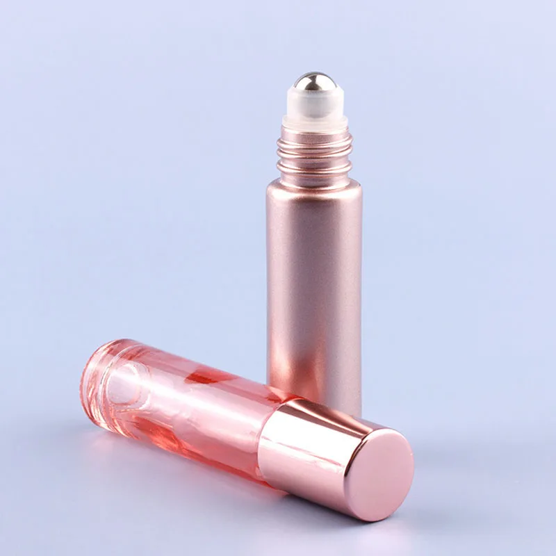 12X 24X 5ML 10ML หนา CLEAR Rose Gold สีชมพูแก้วน้ํามันหอมระเหยม้วนบนขวดลูกกลิ้งโลหะสําหรับน้ําหอมน้ํามันหอมระเหย