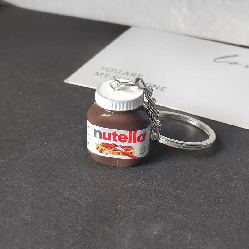 LLavero de botella de mermelada de Chocolate y avellanas de simulación creativa, llavero de pareja, colgante de bolso, llavero de coche, accesorio de regalo, 2 uds.