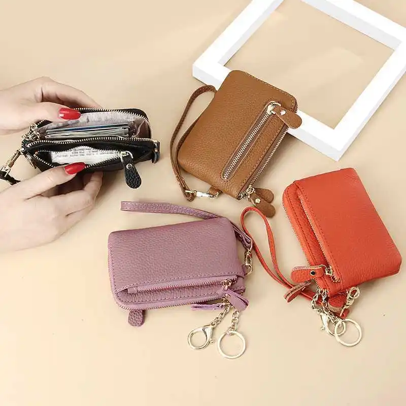 กระเป๋าสตางค์อเนกประสงค์เป็นศูนย์ หนังระดับไฮเอนด์ รุ่นใหม่ปี 2025 สายมือถือเรียบง่ายของผู้หญิง กระเป๋าสตางค์ใบสั้น กระเป๋าใส่บัตร กระเป๋าใส่เหรียญ