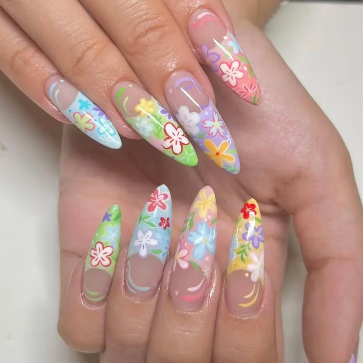 

24Pcs Colorful Flower Graffiti Press on Fake Nails Long Stiletto False Nails with French Design Detachable Full Cover Nails Tips