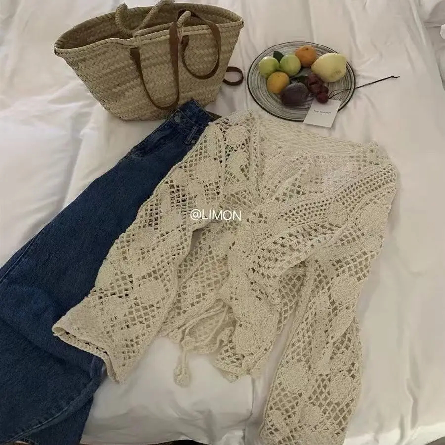 2026 neue Große Lose Sonnencreme Mm Design Hohl Haken Blume Langarm Gestrickte Hemd Abdeckung Top Frauen Äußere