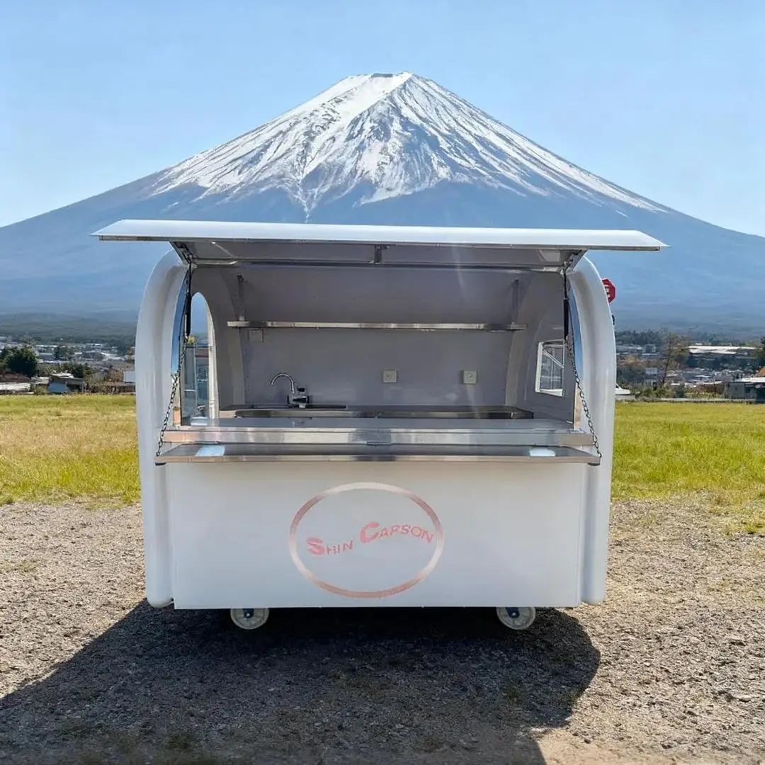 

White Outdoor Food Trailer Minimalist Modern Design Double Sink Storage Cabinets Power Sockets Oversized Sales Window