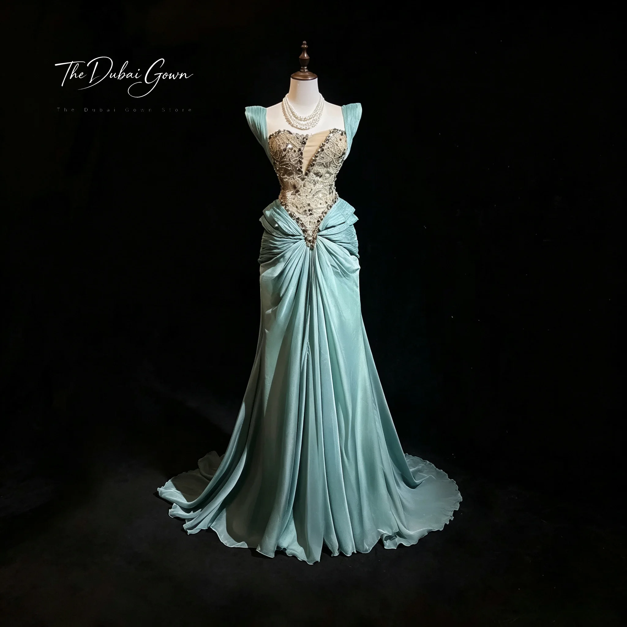 Green off-the-shoulder strapless floor-length mermaid formal gown featuring exquisite embroidery and draping