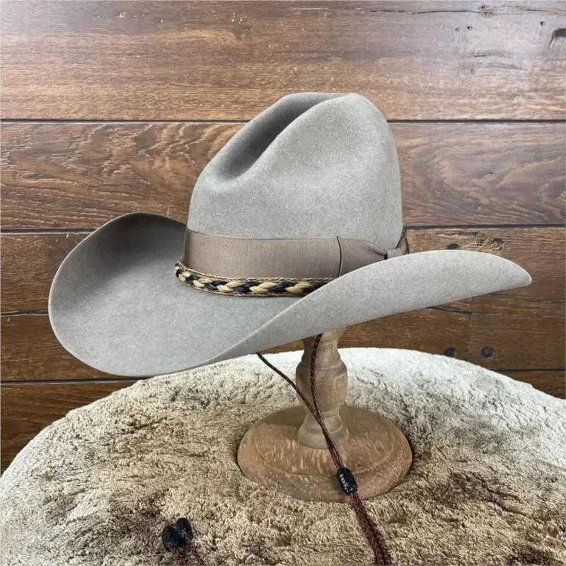 A fashionable woven ribbon decorated top hat with upturned edges and felt
