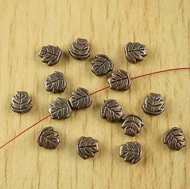 

50pcs 7x6x3mm antiqued copper color 2sided leaf spacer beads HWH1903