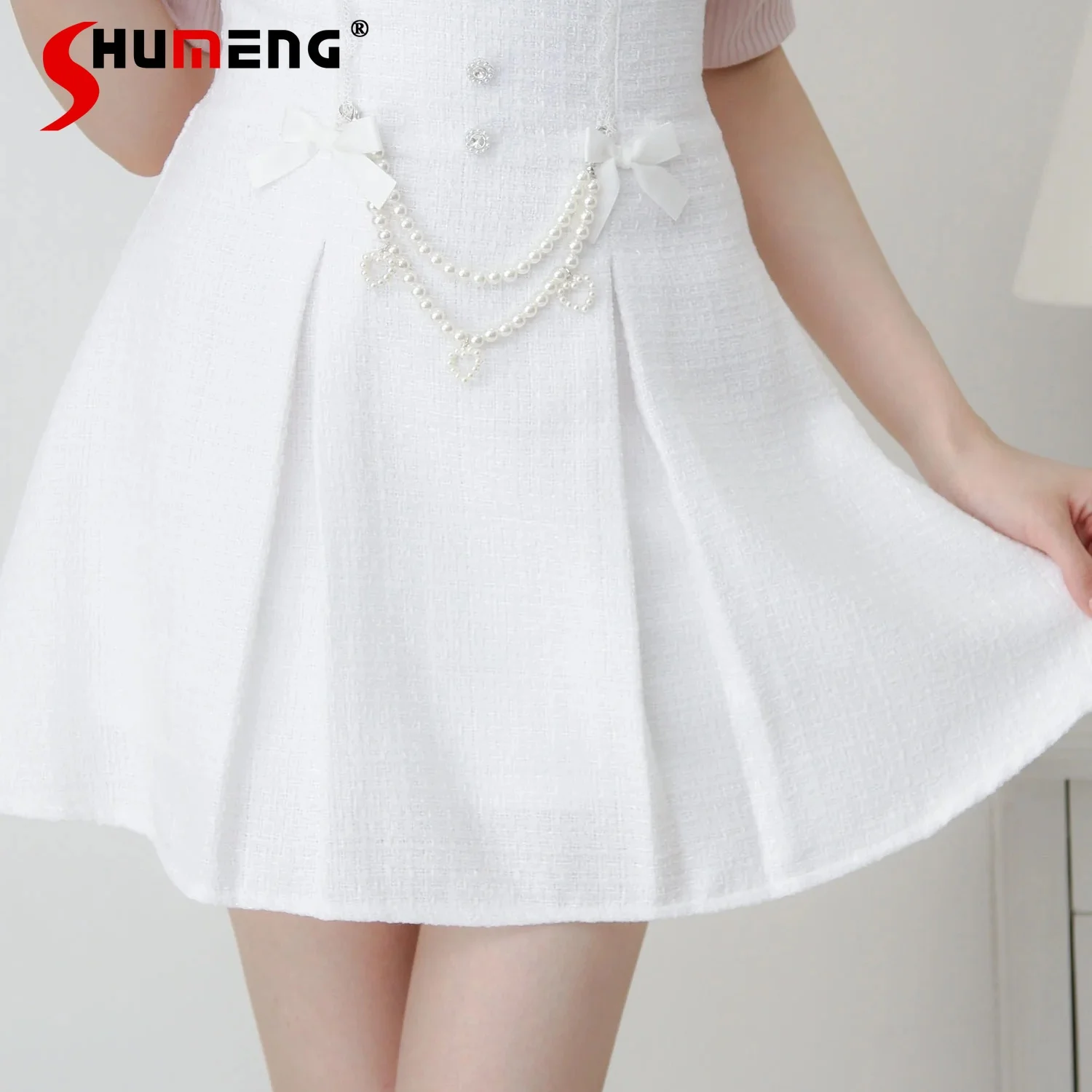 

Японский стиль Mines, массовое производство, милая короткая юбка в стиле Лолиты в стиле ретро с высокой талией, трапециевидной формы с бантом, твидовые плиссированные юбки с жемчугом для женщин