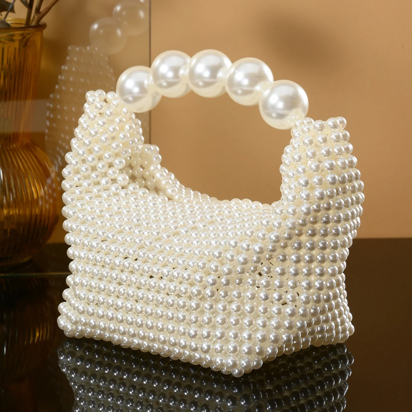 European and American style new beaded handbag Summer women\'s pearl bag hand woven wrist bag Fashion temperament handbag