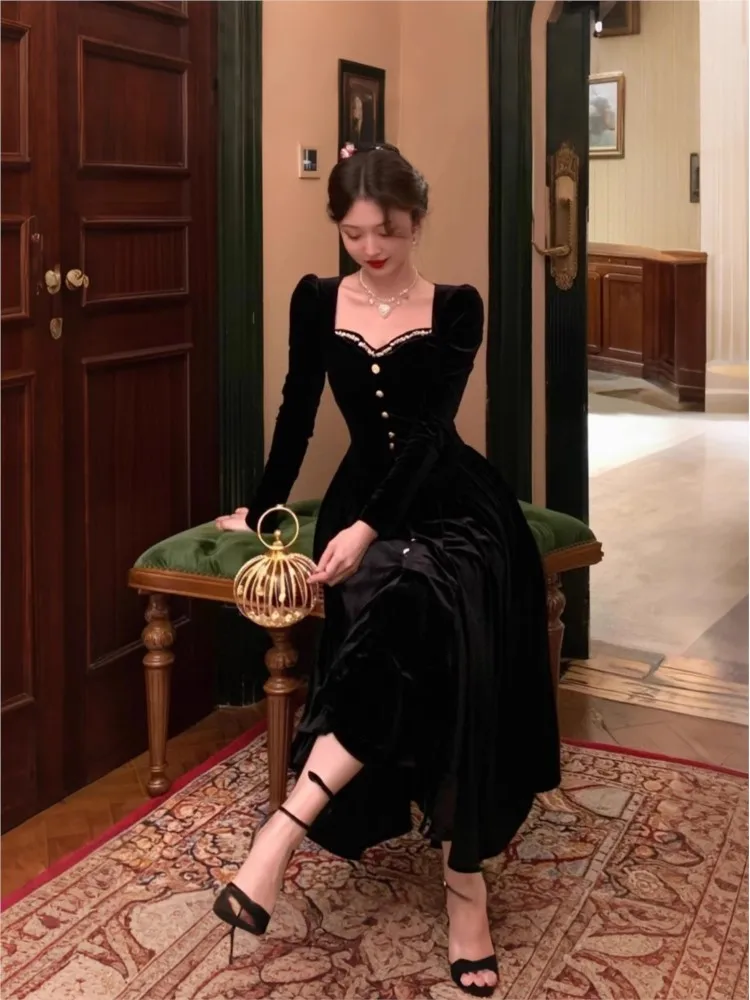 

A Hepburn style black velvet dress with diamond-encrusted waists
