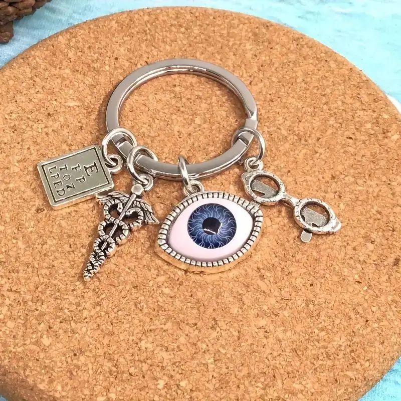 Silvery Charm Keychain With Eye Design, Optometry Themed Keyring With Charms, Unique Accessory For Bags And Keys