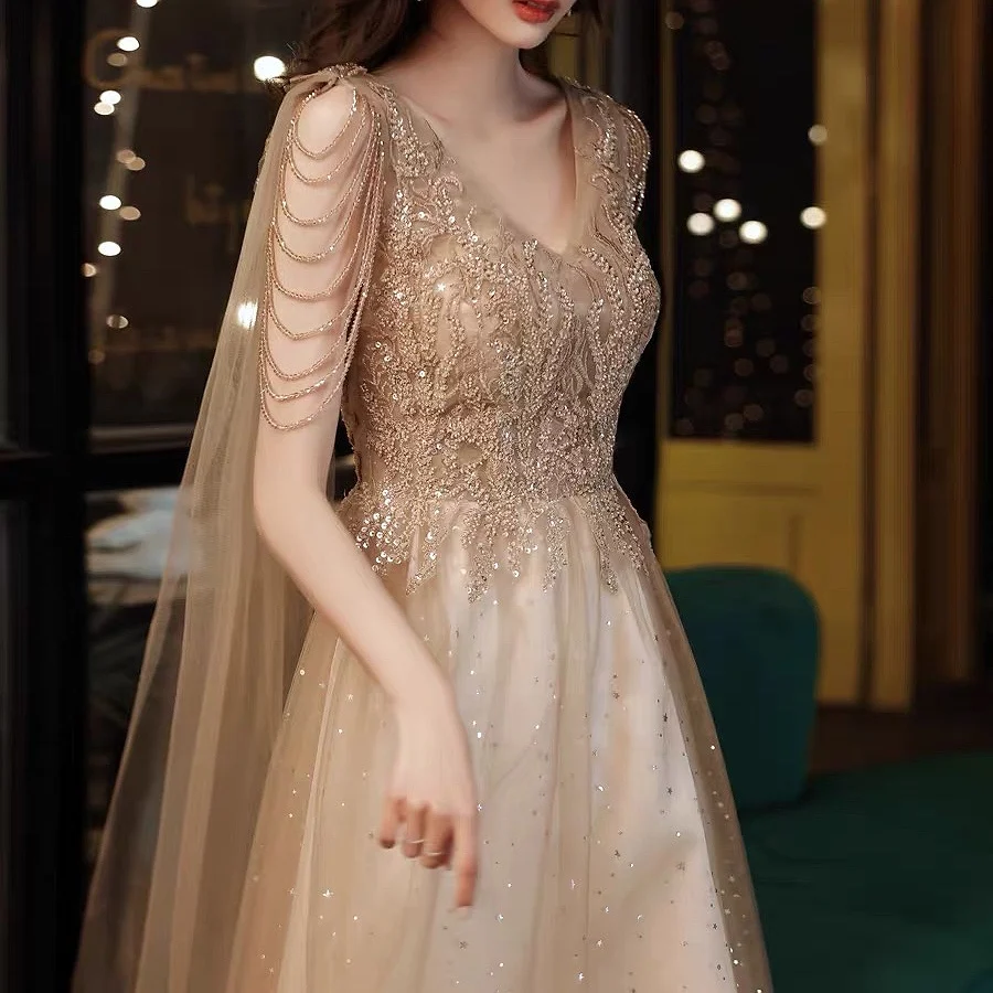 

Champagne Gold Evening Dresses Applique Sequined A Line Sexy V-neck Shiny Tassel Cap Beading Celebrity Prom Party Gowns 2024