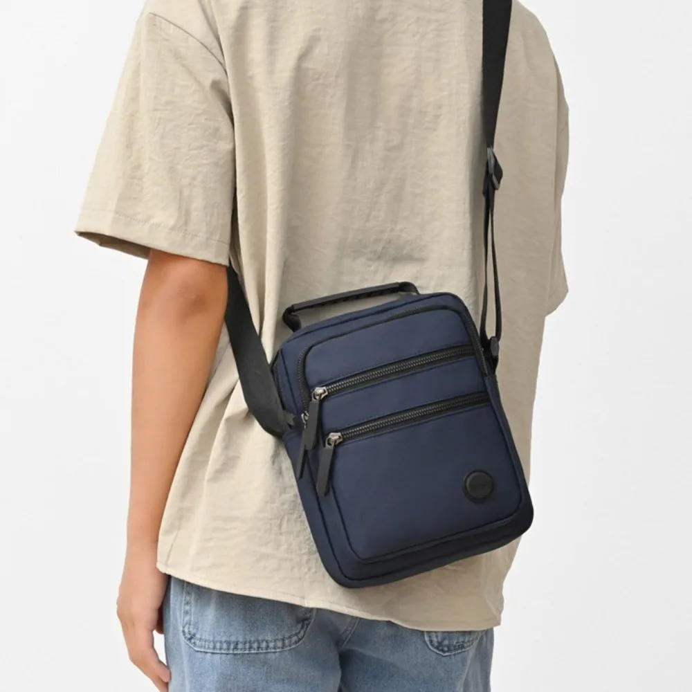 ซิป Multi-Layer Men's Crossbody กระเป๋า Oxford ผ้าแบบพกพาชายธุรกิจกระเป๋าสีทึบเดินทางไหล่เดี่ยวกระเป๋ากลางแจ้ง