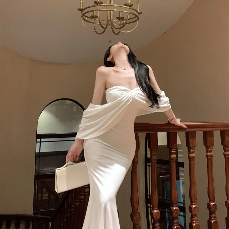 ชุดเดรสยาวสีขาว สายเดี่ยว ทรงหางปลา ดีไซน์เกาหลี เอวสูง แฟชั่นผู้หญิง รุ่นใหม่ล่าสุด ฤดูใบไม้ผลิ ฤดูใบไม้ร่วง