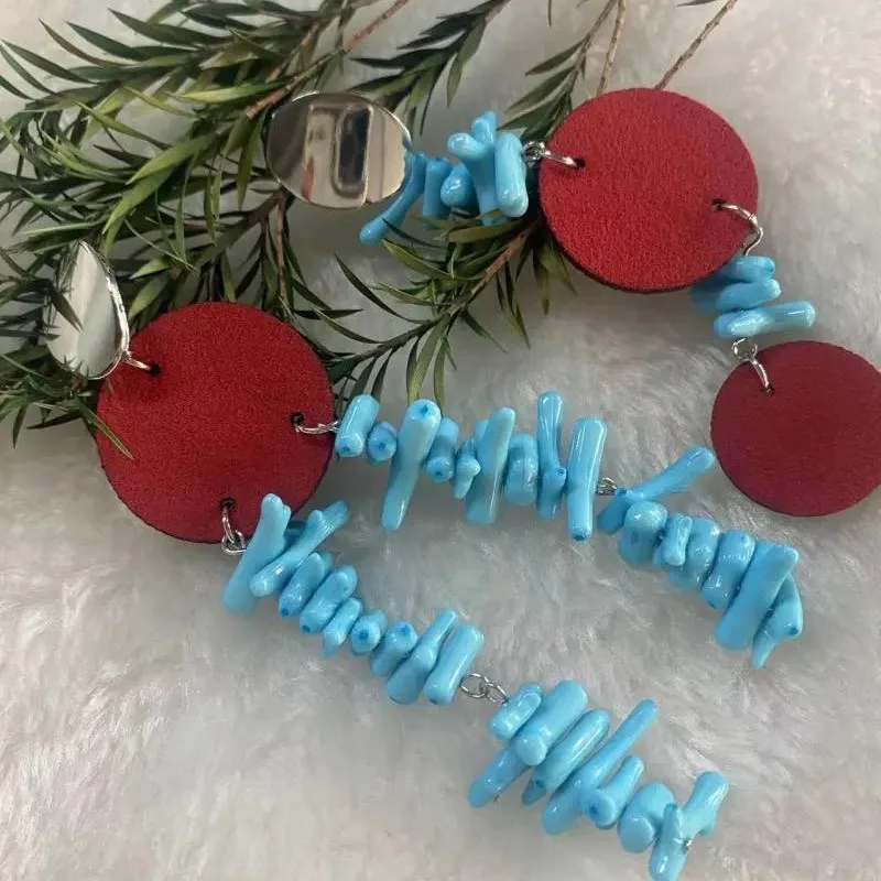 

Red Blue Contrasting Cowhide Sea Bamboo Asymmetrical Niche Earrings