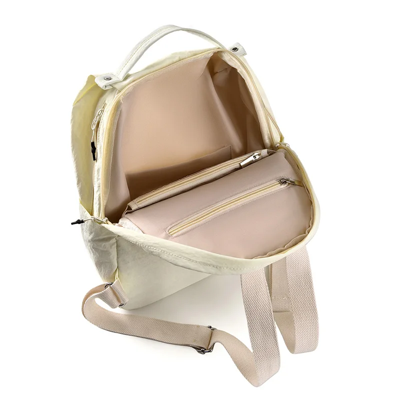 حقيبة ظهر نسائية عصرية متعددة الاستخدامات لعام 2026 حقيبة ظهر كاجوال بسيطة مقاومة للماء من قماش النايلون بتصميم بلون سادة