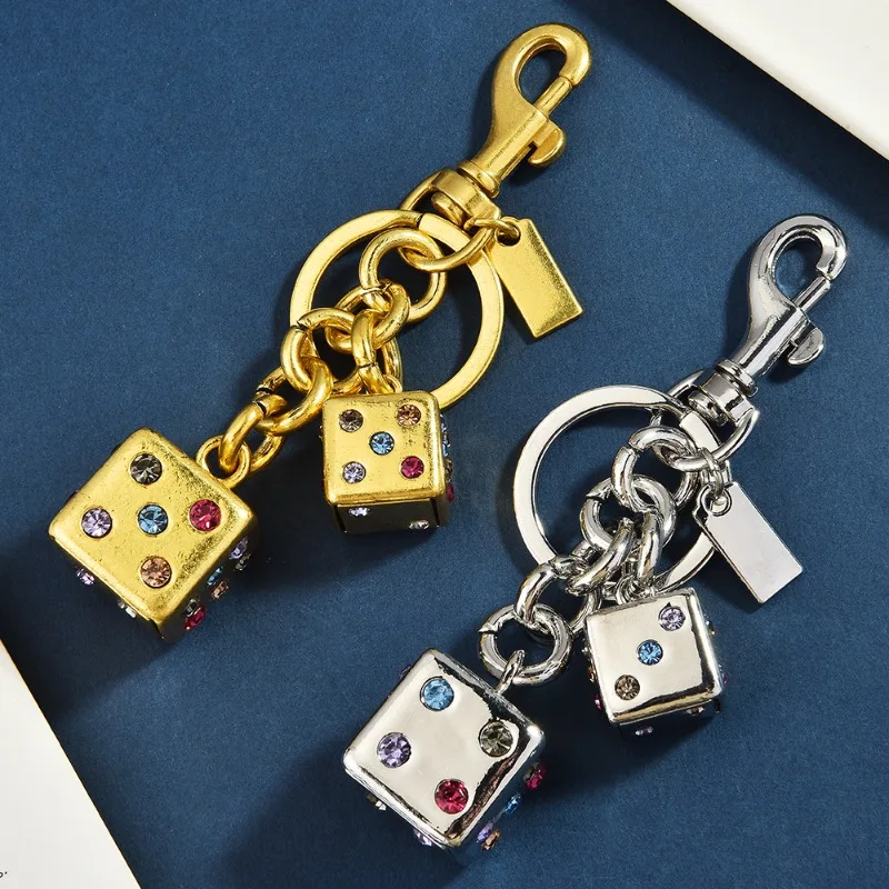 

Creative pink and red diamond-encrusted dice keychains, best-selling bags, gifts and pendants, retro keychains