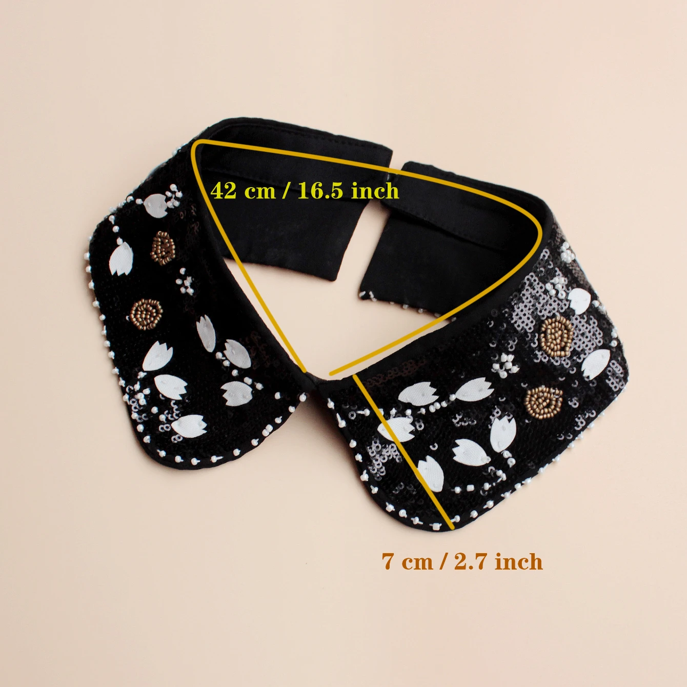 Fashion accessory, luxurious sequined false collar. Classic black background with white flowers. Inlaid with shining bead orname