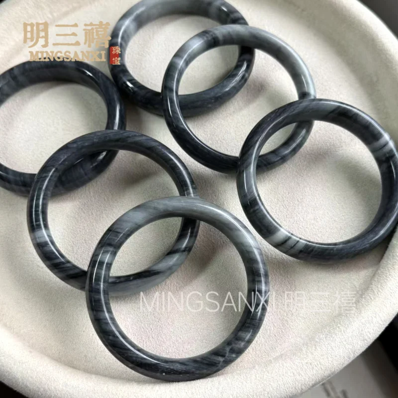 Emerald-colored -bone chicken , black and white semi-landscape ink painting style, smoky rain ice waxy jade bangle, c