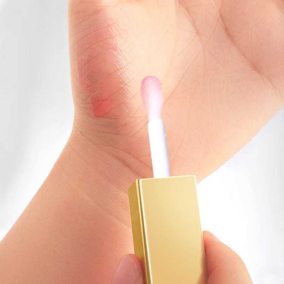 ฉลากส่วนตัวแต่งหน้ามังสวิรัติขายส่ง Lip Oil ช่วยลดความชุ่มชื้นแห้งลิปกลอส Plant Based Lip Care โลโก้ที่กําหนดเอง