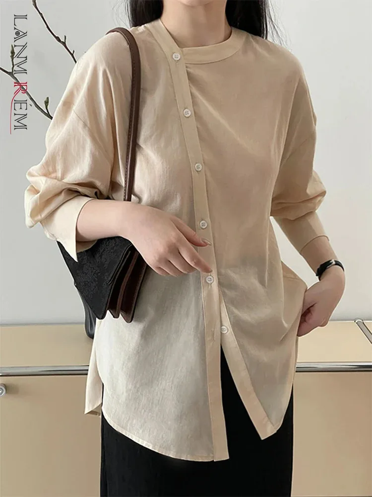 

[LANMREM] Asymmetry Design Sunscreen Women‘s Shirt Stand Neck Long Sleeve Loose Female Blouse 2024 Summer New Top 26D8974