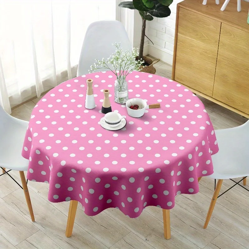 Eine runde Tischdecke mit rosa und weißen Tupfen - aus waschbarem Polyesterfaser.