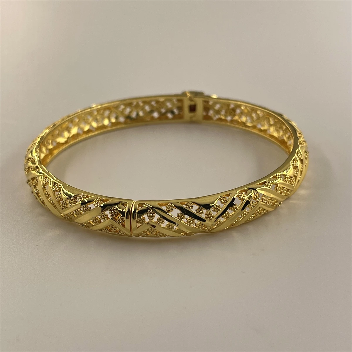 Tough woven pattern hollowed out gold-plated bracelet with retro twist Fried Dough Twists design as a holiday gift for girlfrien