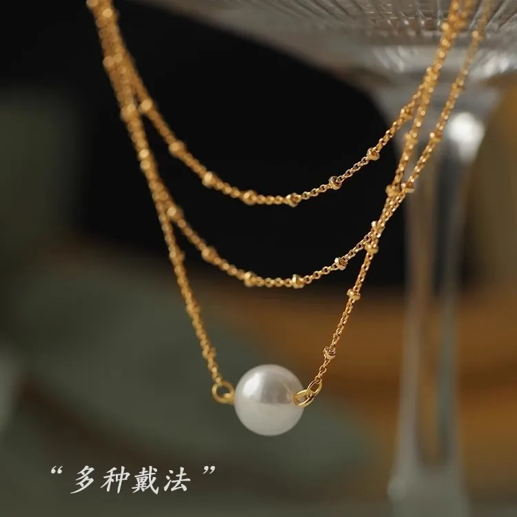 

Multi-layer stacking wearing imitation pearl necklace new women's light luxury niche Internet celebrity collarbone chain neck
