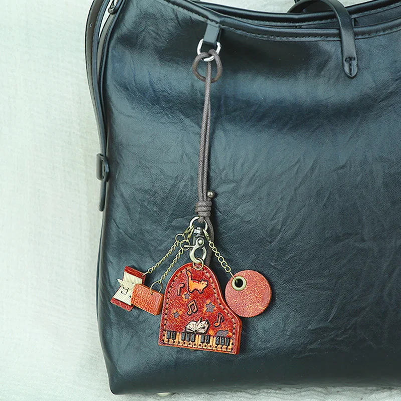 

Cat piano pendant first-layer cowhide backpack music enthusiast genuine leather pendant handmade musical instrument decoration