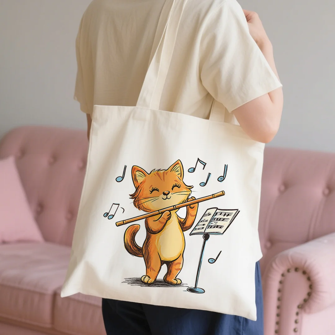 A Music-Themed Cat Print Canvas Tote Bag - Featuring an Adorable Orange Kitten Playing a Flute with Musical Notes, Made from Dur