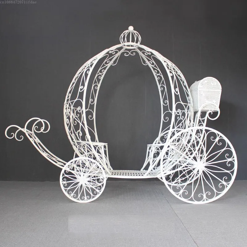 

Forged iron, pumpkin cart, park, forest landscape, treasure chest, carriage, wedding decoration, props, flowers, arches