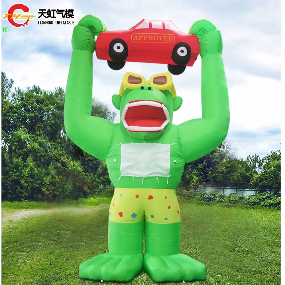 

Outdoor Giant Inflatable Gorilla Cartoon Holding a Car Rooftop Advertising Inflatable Gorilla Balloon for Car Promotion