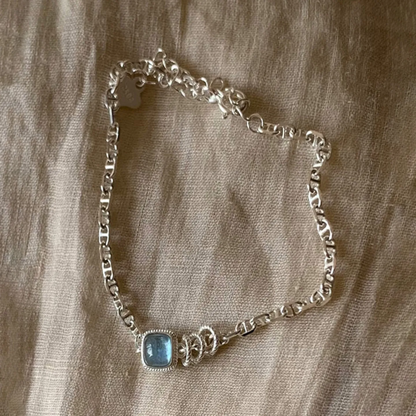 Delicate Intricate Silver Linked Chain Central Blue Square Glow Stone Elegant Glimmering Wrist Decor Daily Accessory