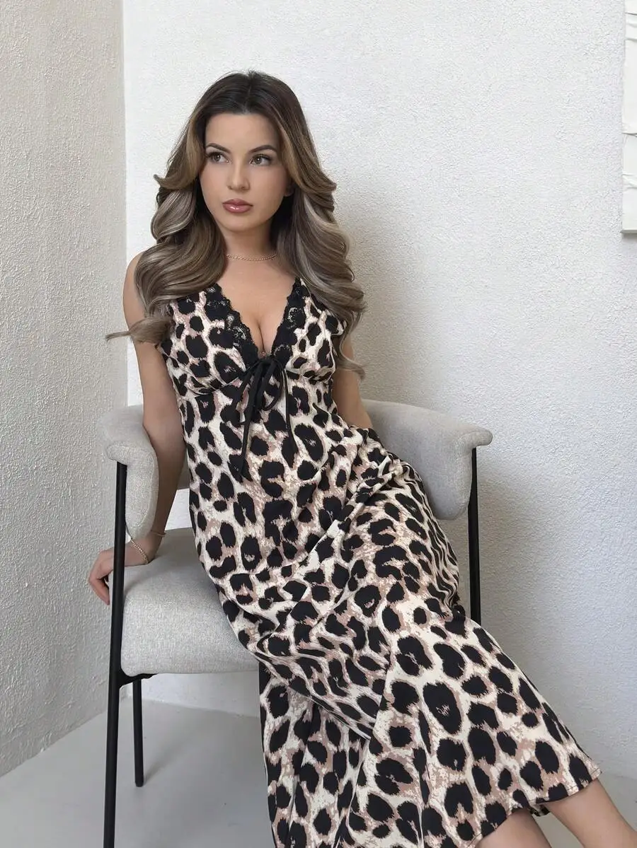 

Sleeveless Leopard Midi Dress With Deep V-Neck Lace Trim, Front Tie Bow, And Waist Defining Silhouette For Summer Occasions