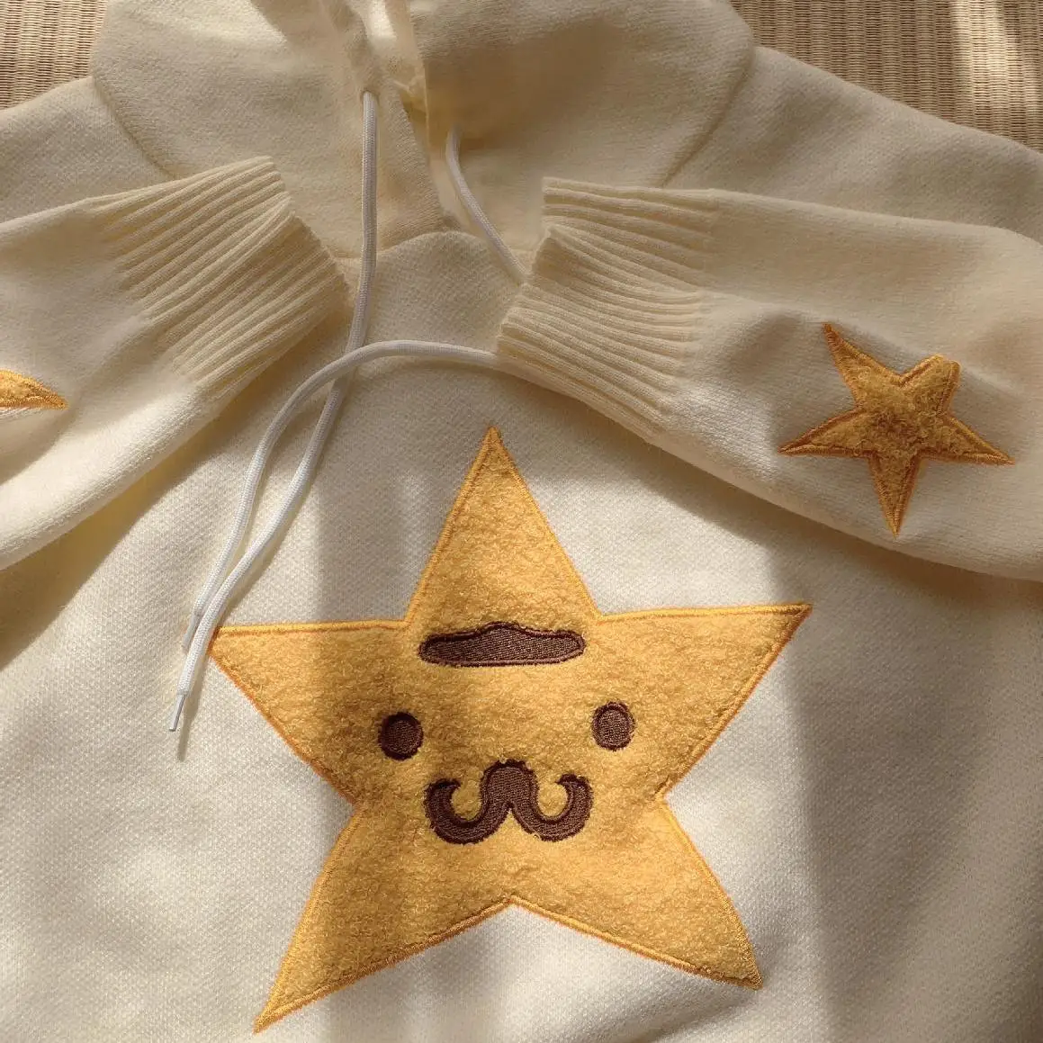 เสื้อสเวตเตอร์ถักมีฮู้ดทรงหลวมสไตล์เรโทรลายดาวสำหรับผู้หญิง แขนยาว ทรงกลม รุ่นใหม่