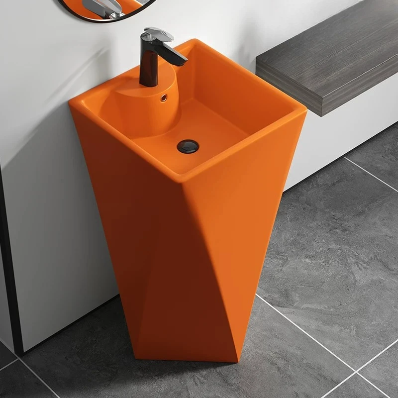 Matte washbasin, floor-standing orange sink, black integrated basin