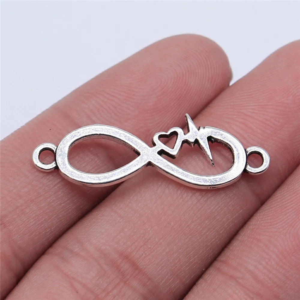 

Wholesale 150pcs/bag 32x11mm Antique Silver Color KC Gold Color Infinity Symbol Heart Heartbeat Connector Charm