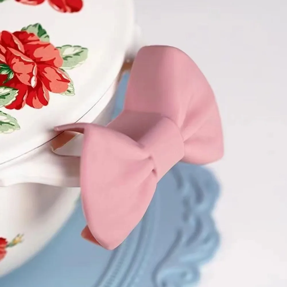 2PCS New Silicone Heat Insulator Clip Bow Tie Shape Mini Pot Handle Cover Pinch Grip Heat Resistant Oven Mitt Home Kitchen view 3