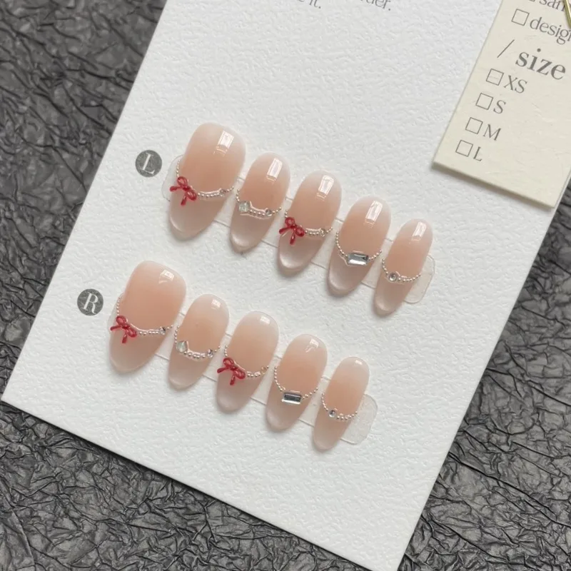 

10Pcs Handmade Medium Almond Nails Nude Cat Eye Elegant False Nails with Red Bow&Diamonds French Nail Tips for Girls Daily Wear