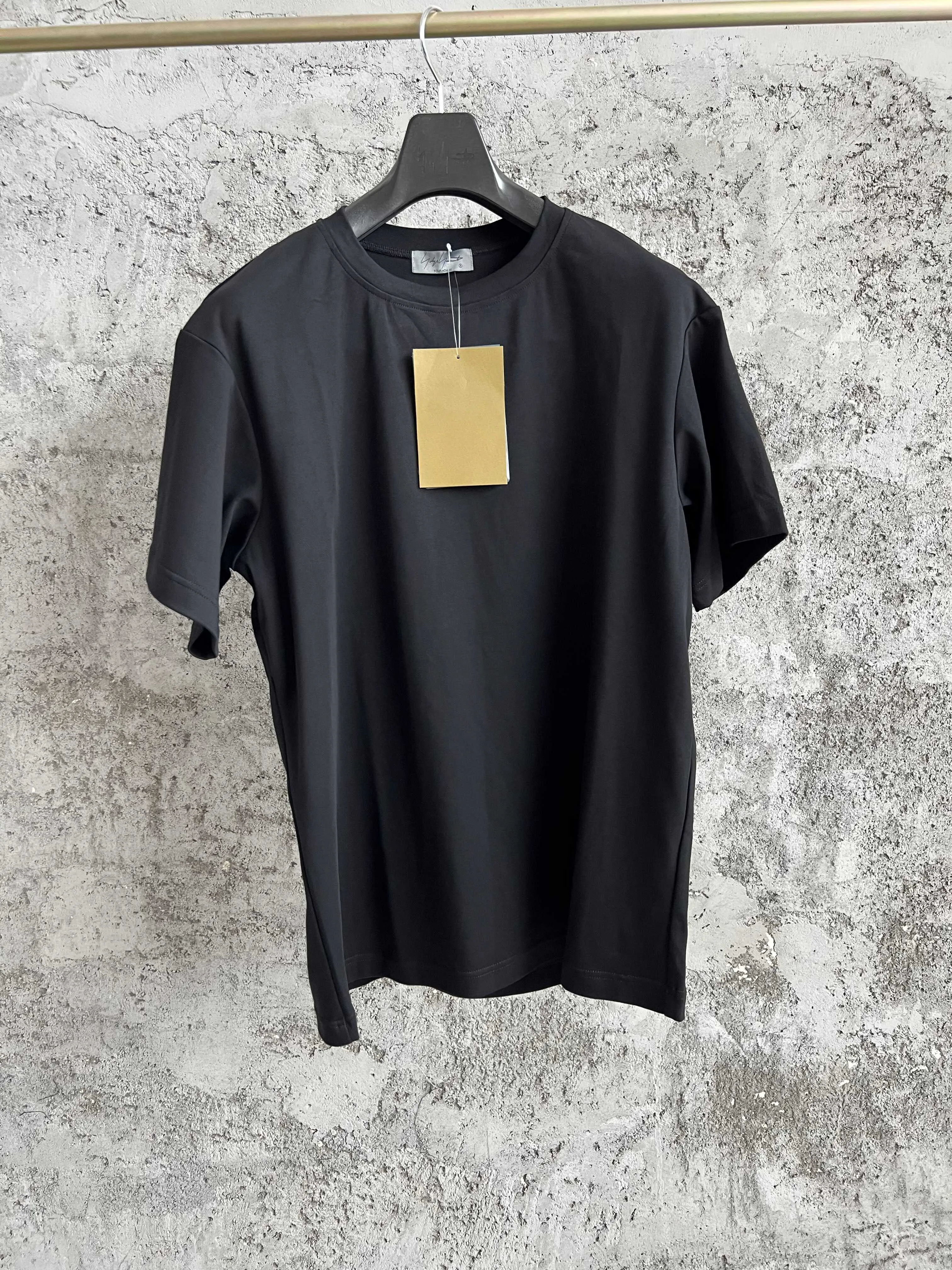 A loose, pure cotton, asymmetrical black long-sleeved T-shirt hoodie for men