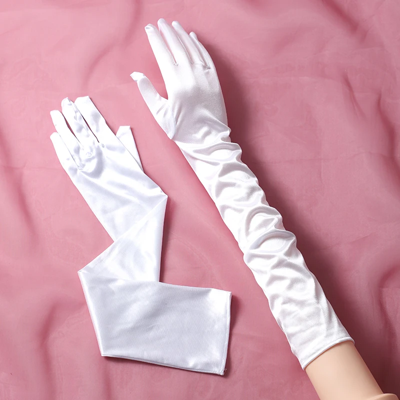 The bride's accessory is a pair of long white gloves suitable for women's wedding parties