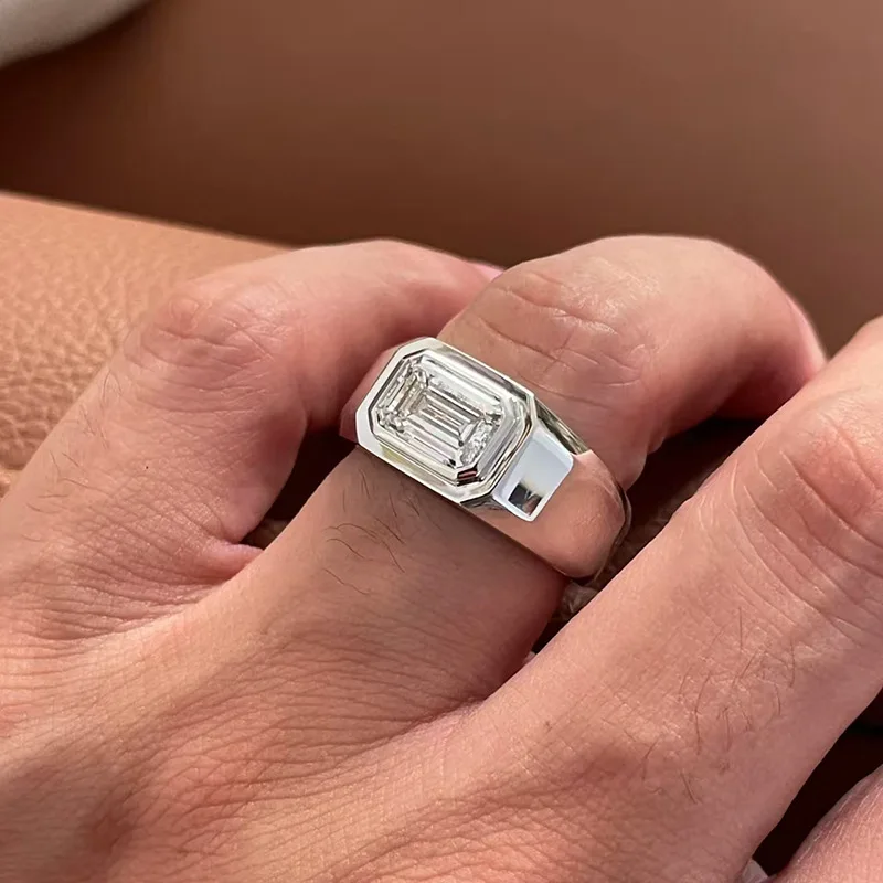 

A minimalist men's ring made of 925 sterling silver, featuring an irregular shape with a D-color 2-carat moissanite stone, gold-