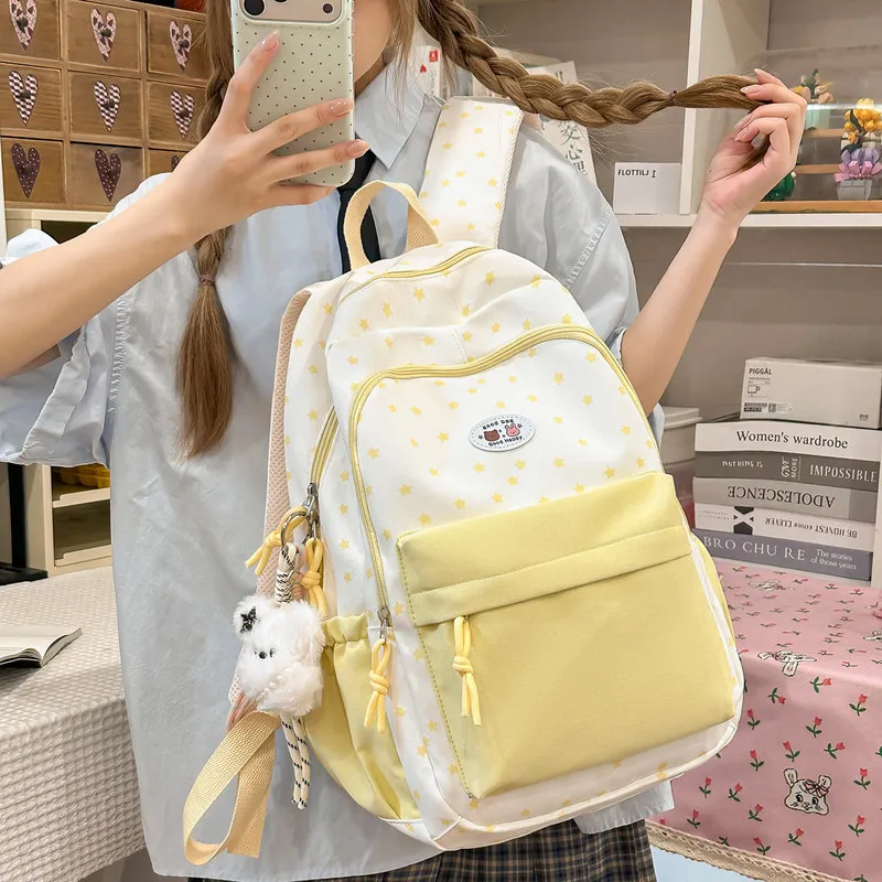 Stylish backpack for girls, featuring a cute star print, large capacity, suitable for middle school students, with a unique and